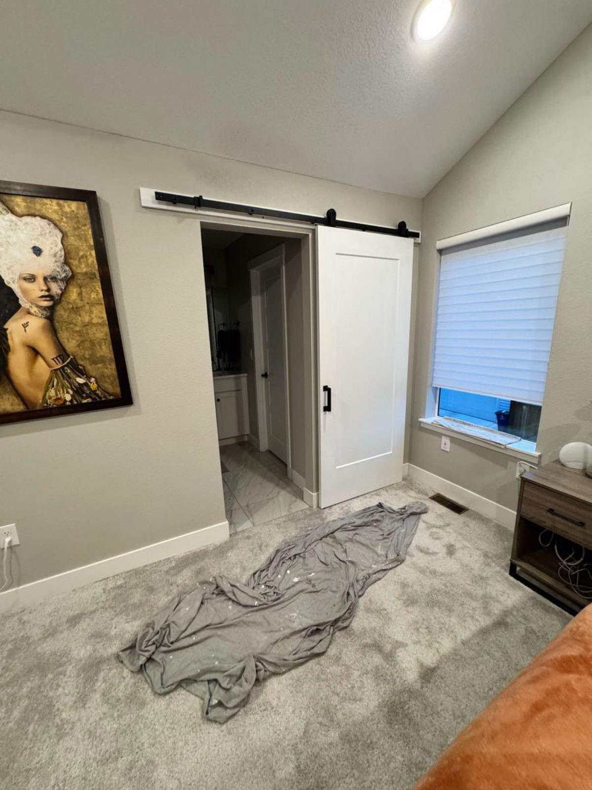 Custom sliding barn door install in a bedroom
