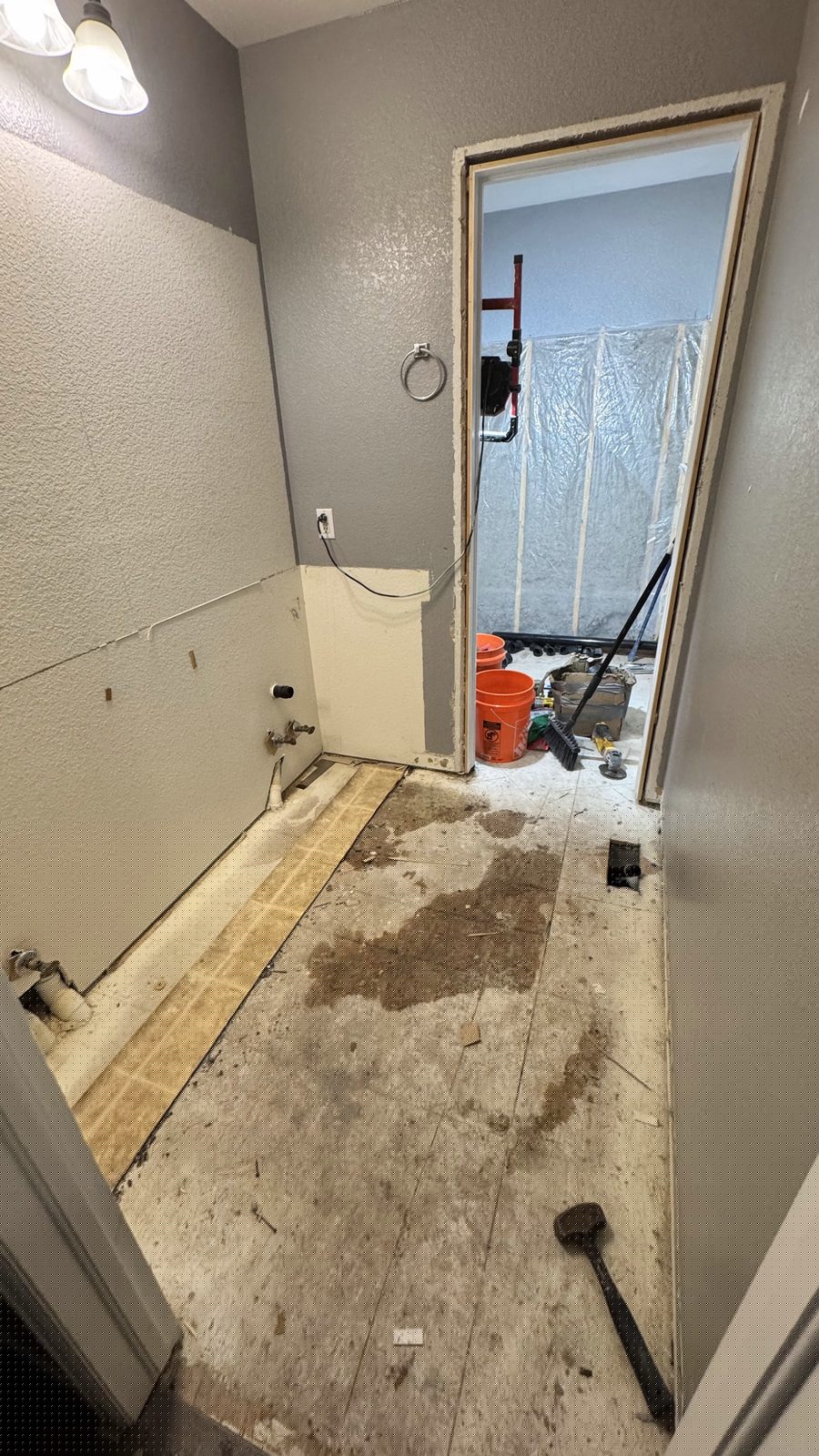 Bathroom during remodel — demo and subfloor prep