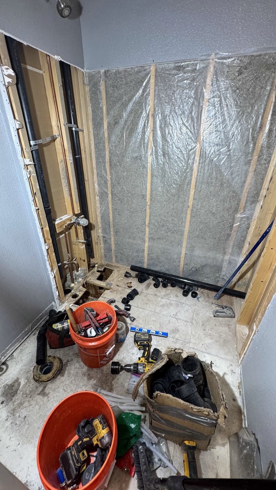 Bathroom remodel in progress — framing and plumbing