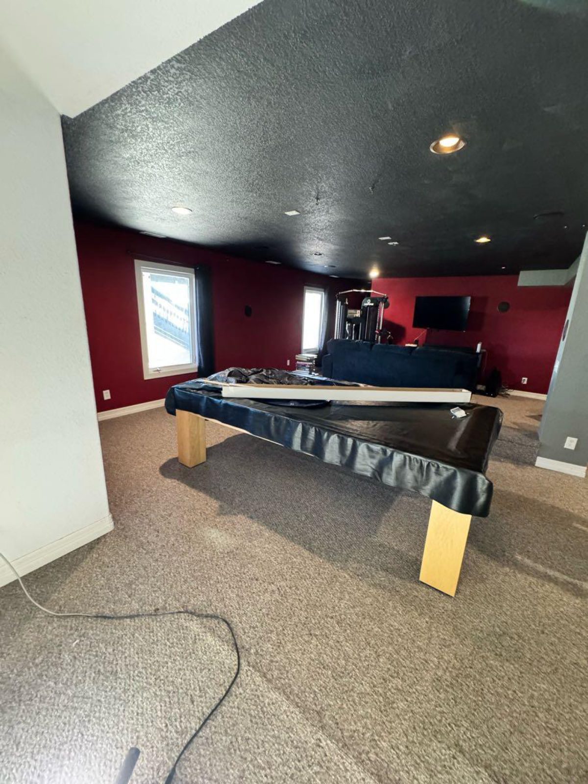 Finished basement rec room with accent ceiling