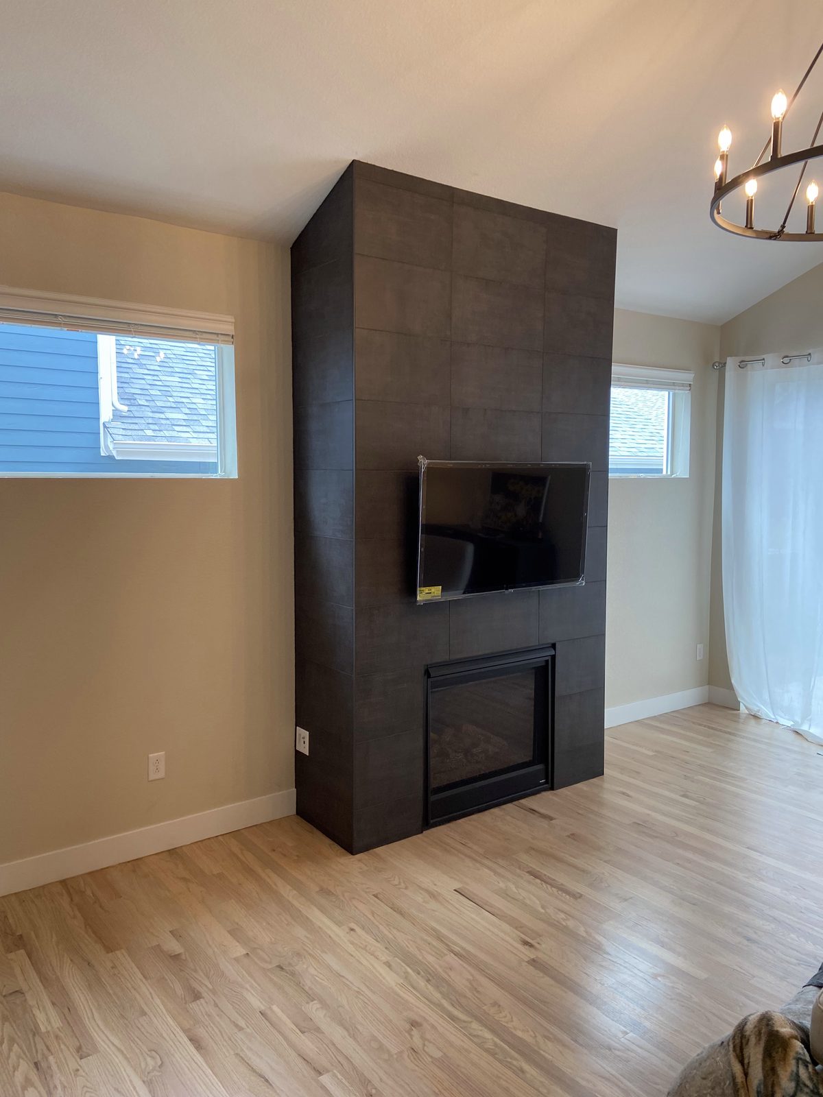 Living room refresh with custom wood feature wall and mounted TV