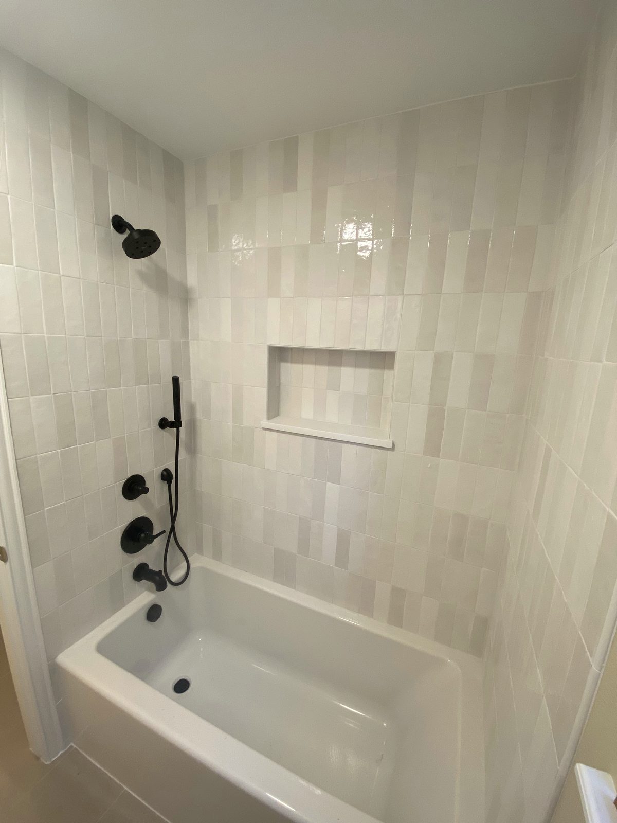 Tile tub and shower remodel with built-in niche in the Denver Metro Area